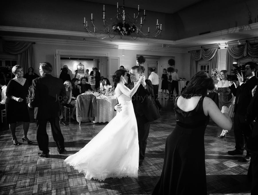 a bride and groom dance in the grand ballroom of Longue Vue Club