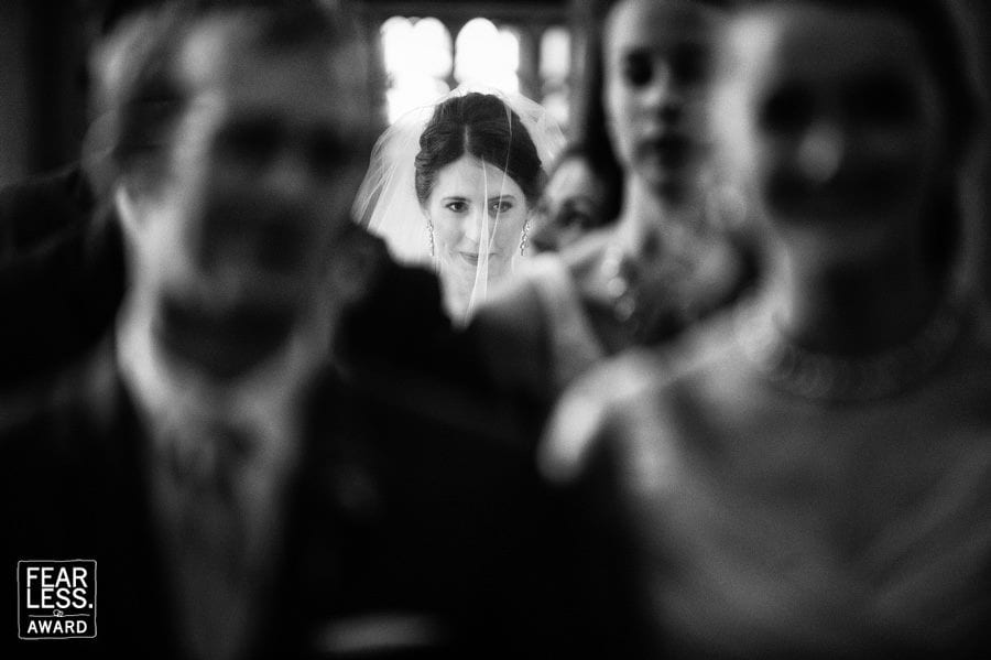 Fearless Award: a picture from an award winning Pittsburgh wedding photographer showing a bride with a look of concentration on her face as she prepares to walk down the aisle.
