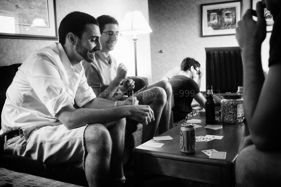 groom and his best man play cards and drink beer before the wedding West Virginia Wedding Photography