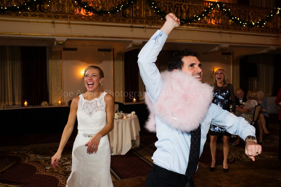 wedding guest dances with the bride's fur wrap William Penn Hotel Wedding Photography