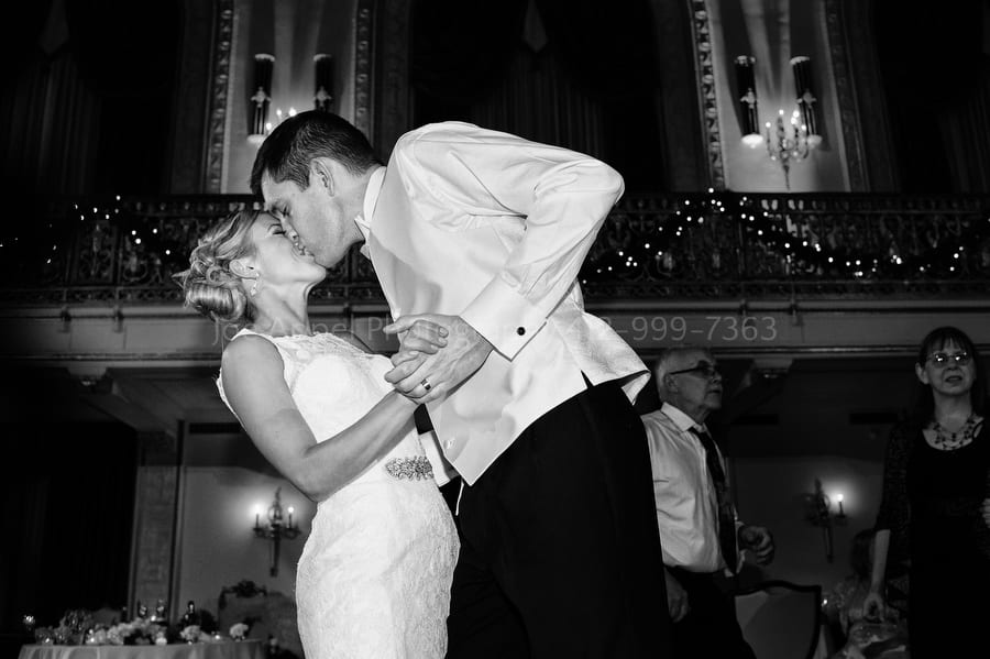 bride and groom kiss as they dance during their wedding reception William Penn Hotel Wedding Photography