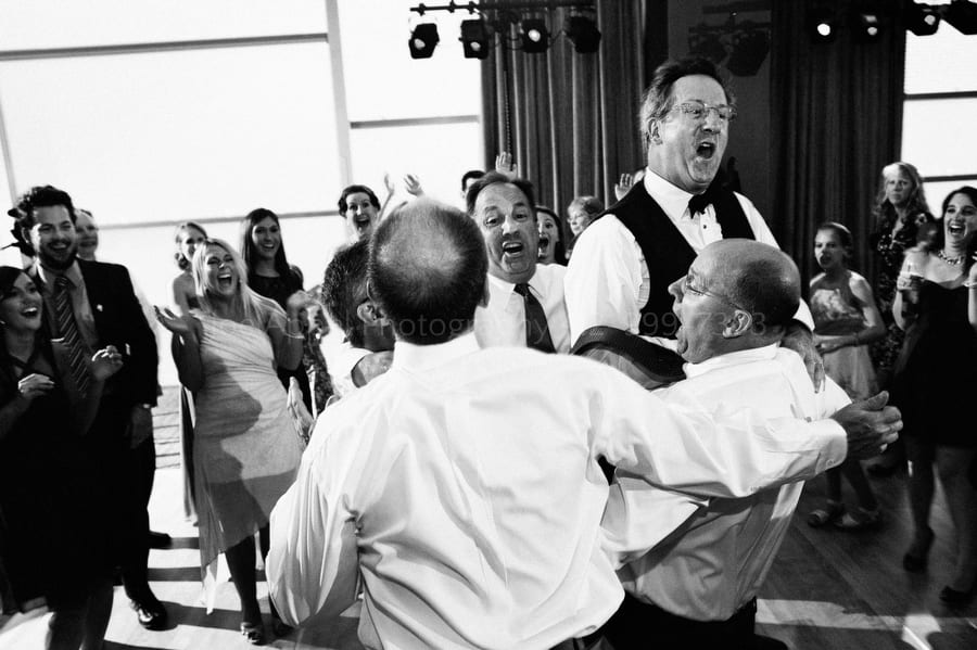 A circle of men bounce off of each other as they jump into the air fairmont pittsburgh wedding