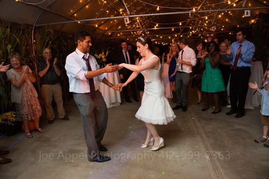 a husband and wife dance during their wedding reception outdoor wedding in pittsburgh