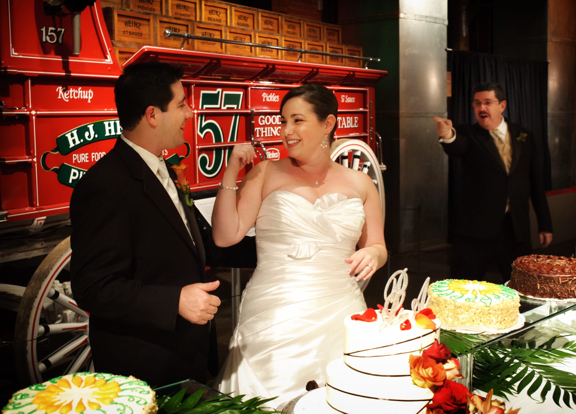 A man points and yells at a bride and groom during their Heinz History Center Wedding.