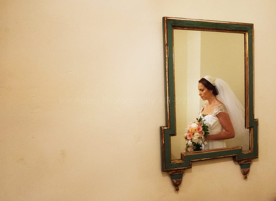 bride reflected in a mirror on her wedding day