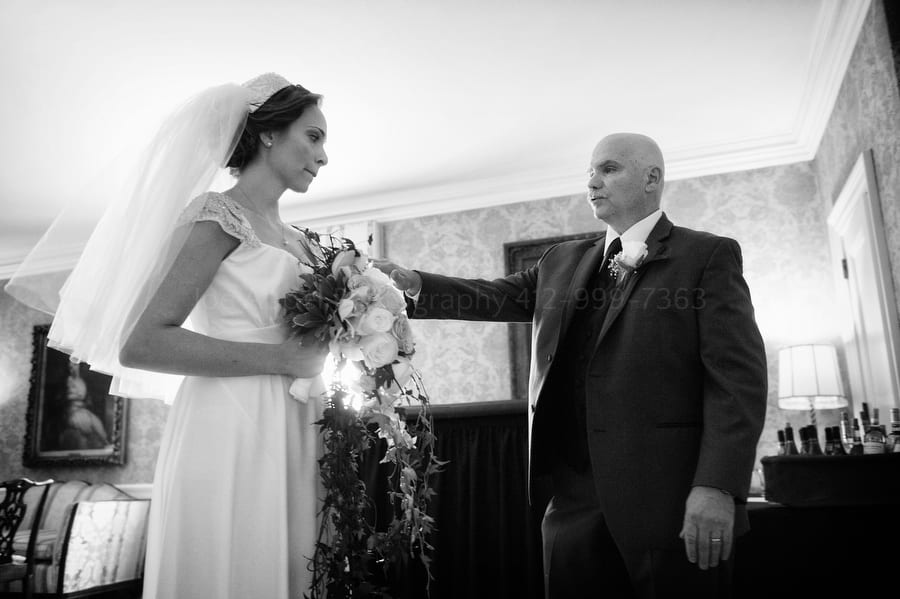 nervous bride with her dad before a wedding ceremony