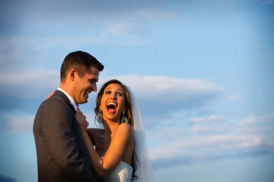 beautiful bride reacting with surprise to something her husband said