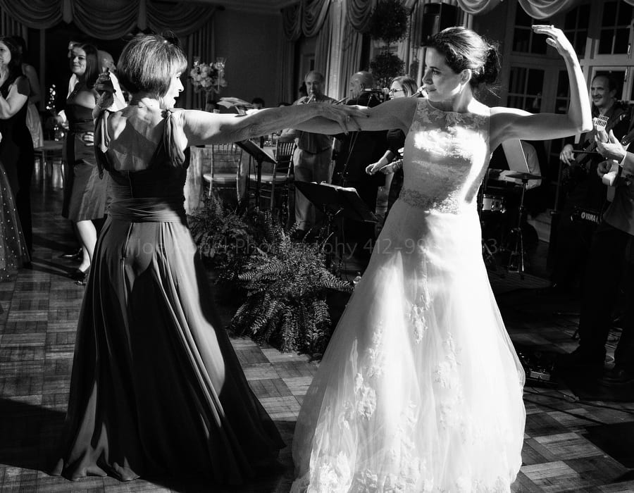 a bride and her mother dance during her wedding