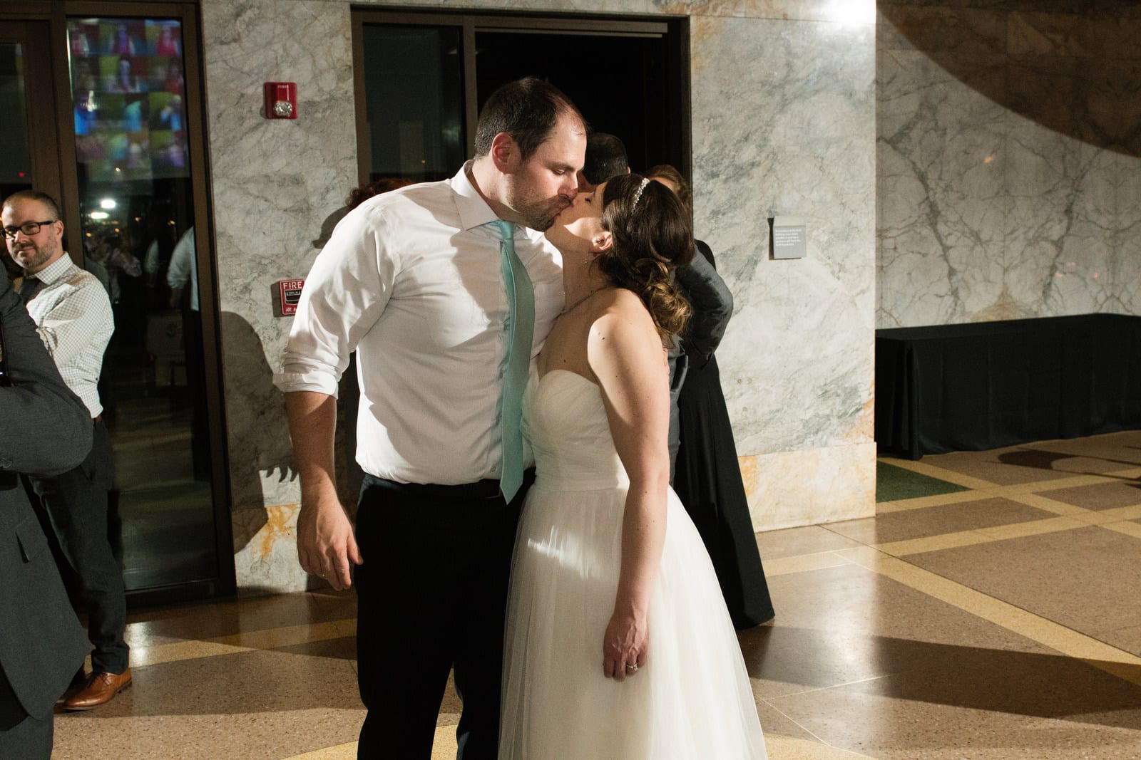 A bride and groom kiss during the reception of their Children's Museum Pittsburgh Wedding.