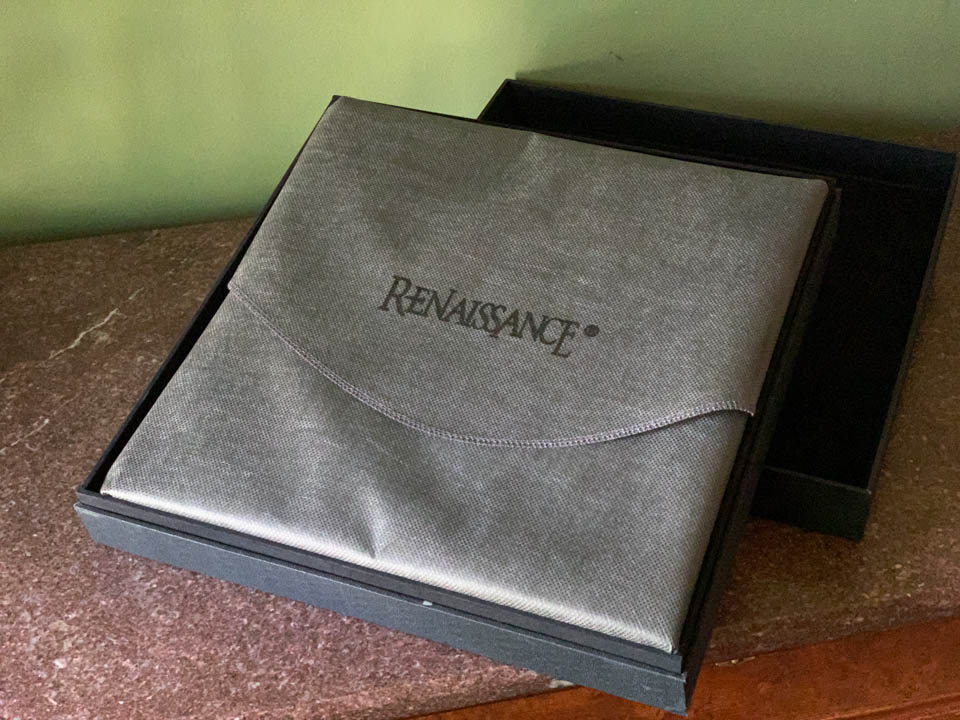 The presentation box of a 12x12 album with book wrapped inside a protective sleeve.
