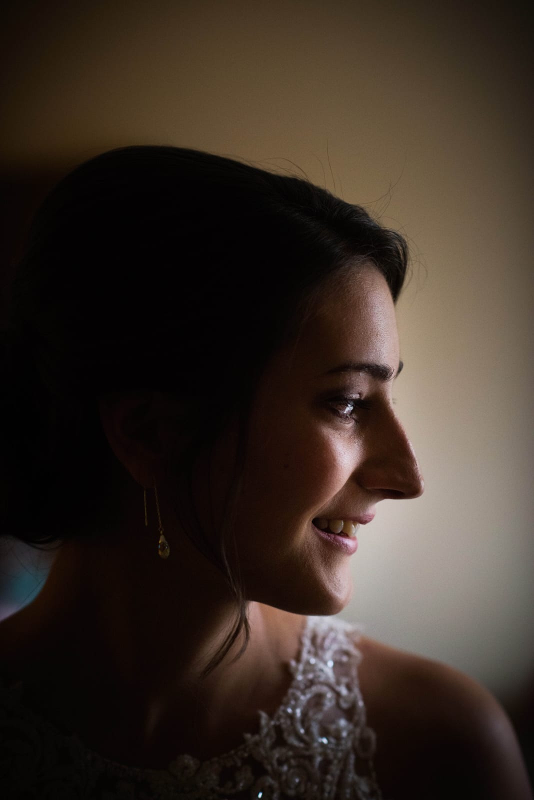 A profile of a smiling bride before her Heinz Chapel wedding.