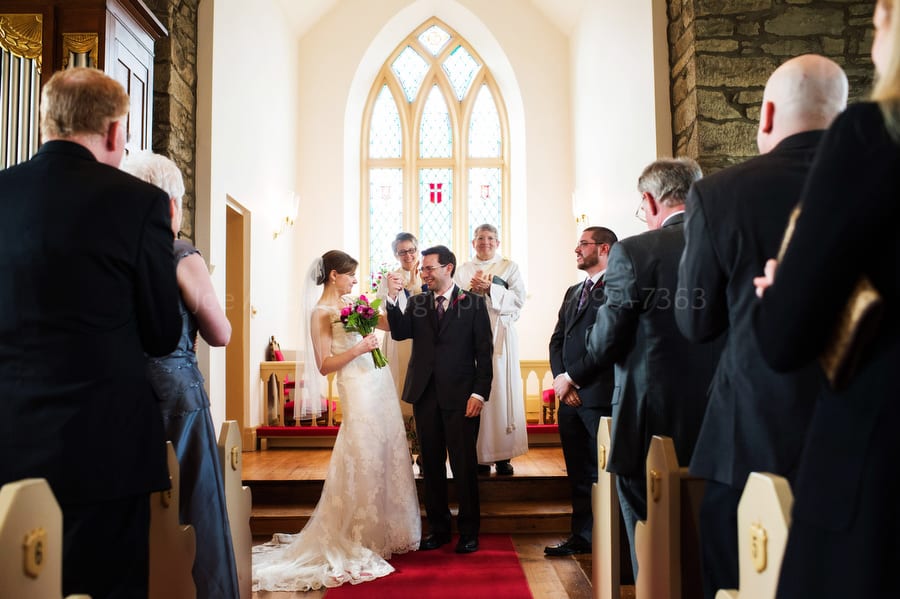 bride and groom celebrate after they're announced as man and wife. Old St. Luke's Church Wedding