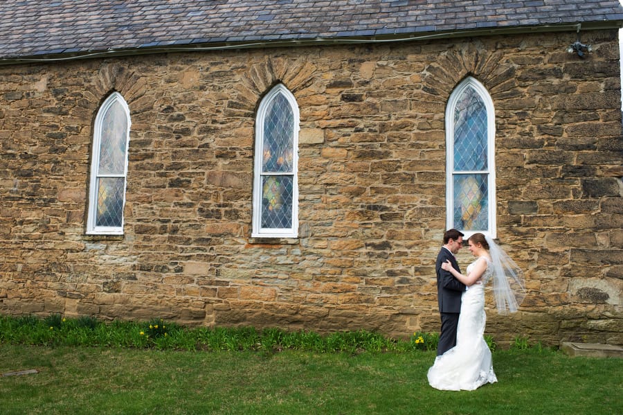 bride and groom kiss outside of Old St. Luke's church in Pittsburgh after their wedding. Old St. Luke's Church Wedding