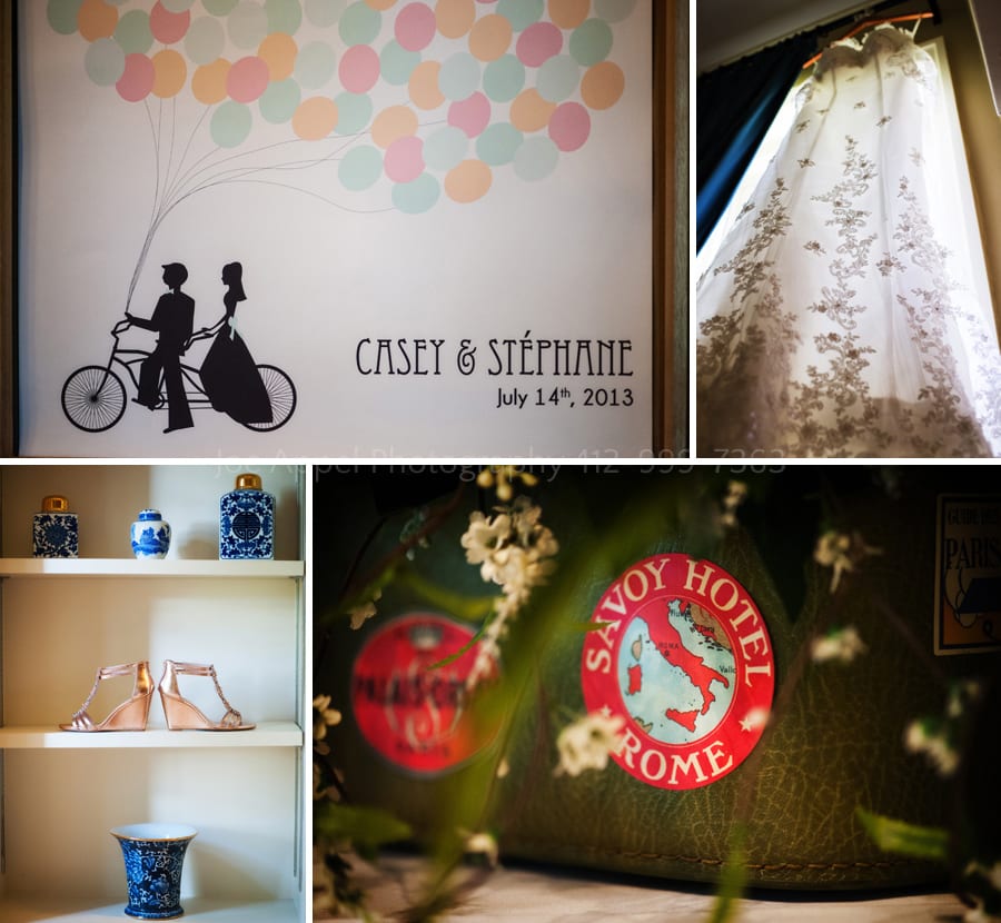 details from a wedding include a lace dress, a sign with bride and groom on bicycle with balloons a vintage suitcase with stickers from foreign ports and a beautiful pair of shoes amongst chinese pottery