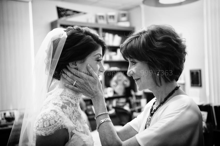 mother of the bride caresses her daughter prior to the wedding West Virginia Wedding Photography