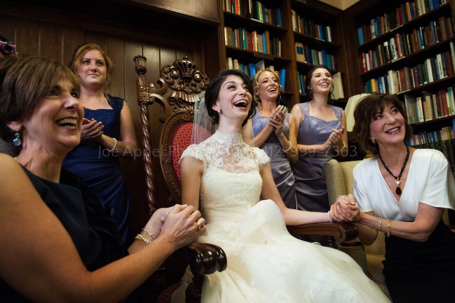 a bride smiles and laughs as she sees her groom as he enters the room for the bedeken West Virginia Wedding Photography
