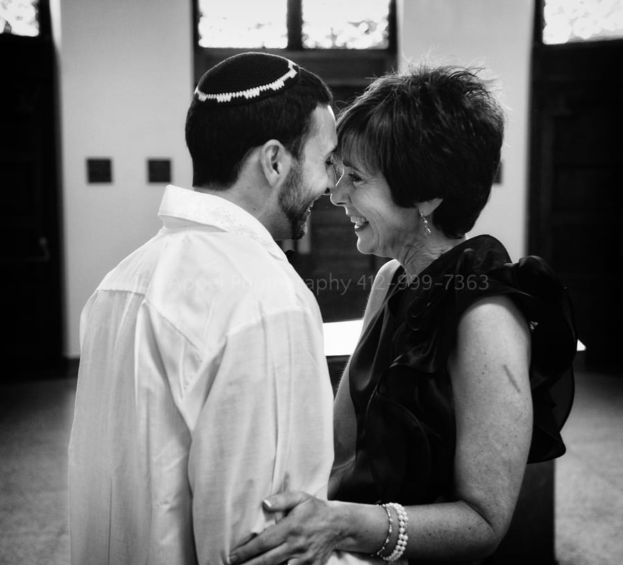 groom and his mother share a moment of love before his wedding ceremony West Virginia Wedding Photography