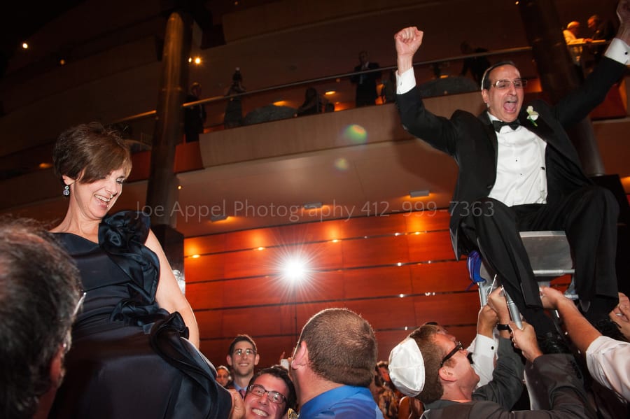 groom's parents are lifted on chairs during the hora West Virginia Wedding Photography