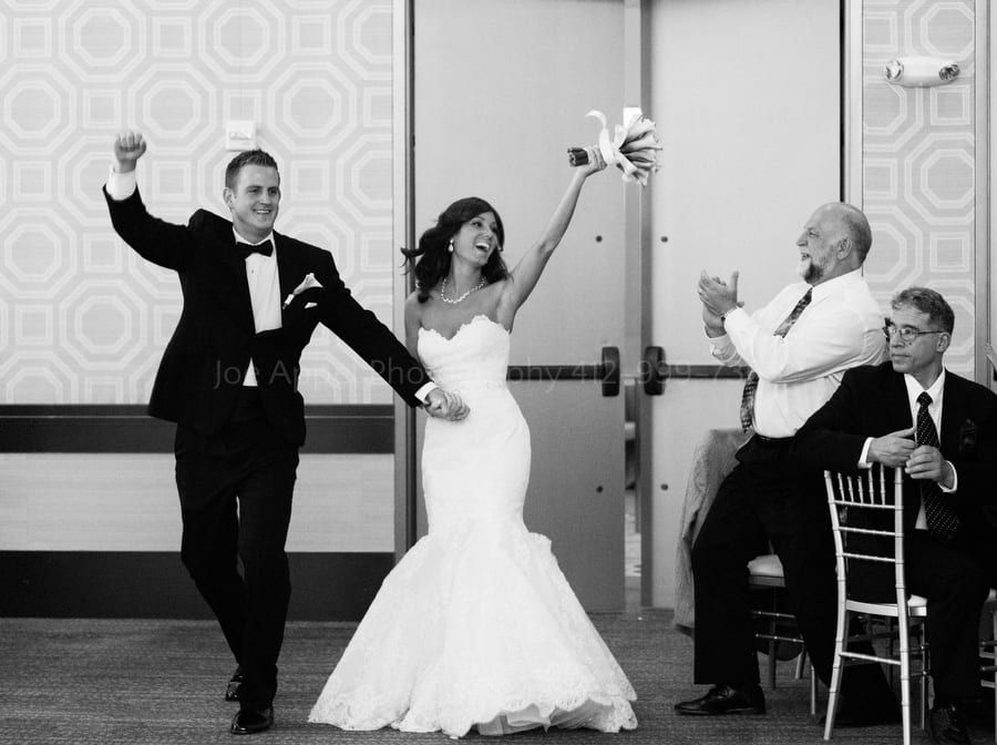 A man applauds as the bride and groom are introduced into their wedding reception fairmont pittsburgh wedding