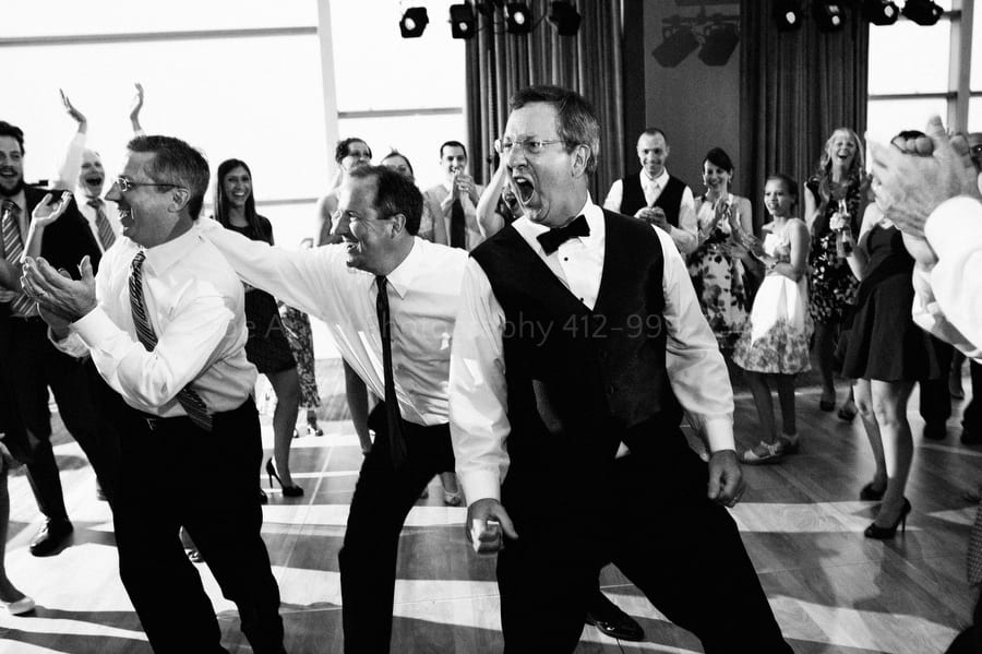 the father of the bride yells after jumping into the air with his brothers fairmont pittsburgh wedding