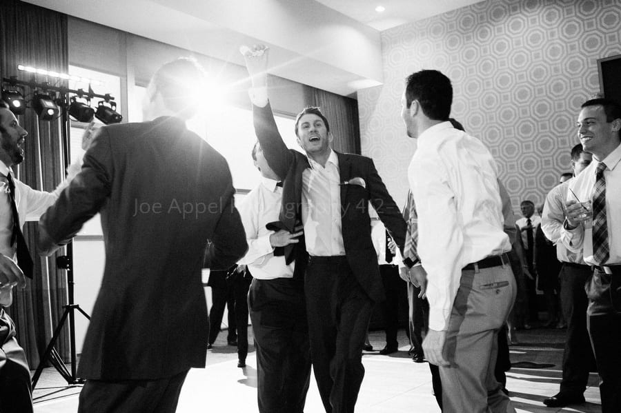 a single man jumps for the garter tossed by the groom fairmont pittsburgh wedding