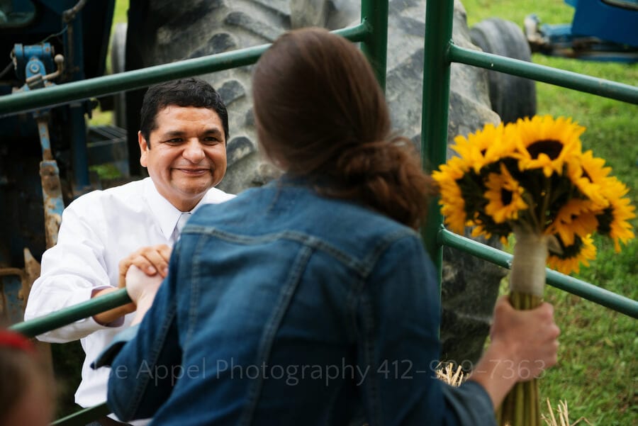 the groom's father shows his love to his new daughter in law outdoor wedding in pittsburgh