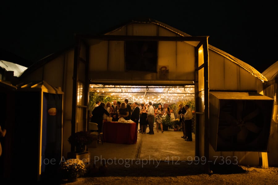 outside view of the greenhouse where a wedding reception is taking place at Simmons Farm outdoor wedding in pittsburgh