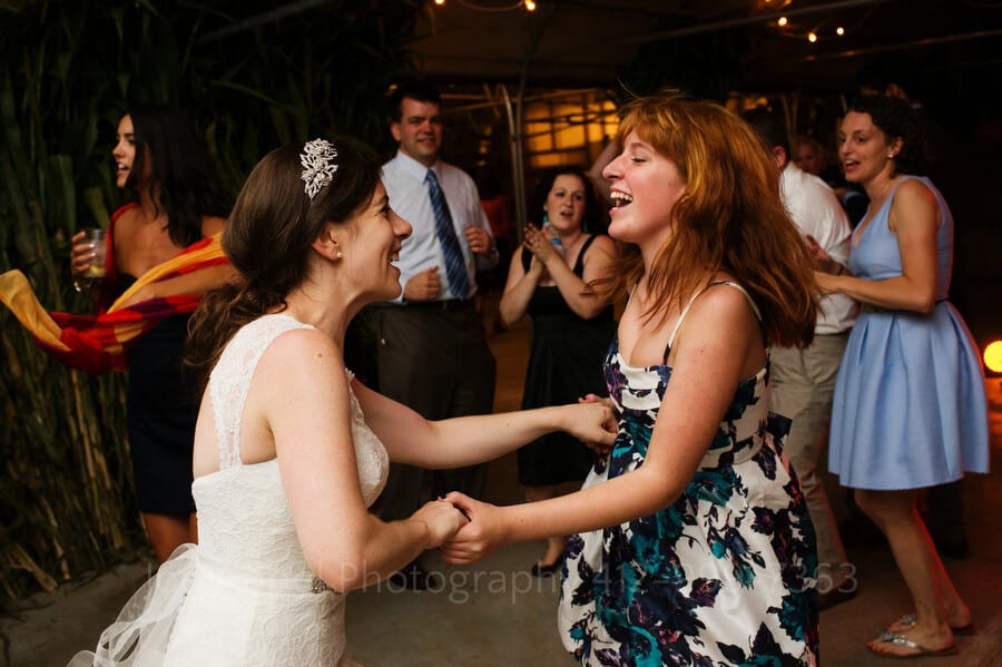 a bride dances with her niece during her wedding reception outdoor wedding in pittsburgh