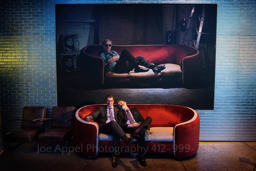 two men sit on Andy Warhol's couch andy warhol museum wedding