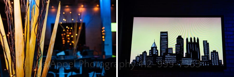 dramatic lighting on the wedding reception area in the main foyer of the Warhol Museum along with a stylized artistic rendering of downtown pittsburgh andy warhol museum wedding