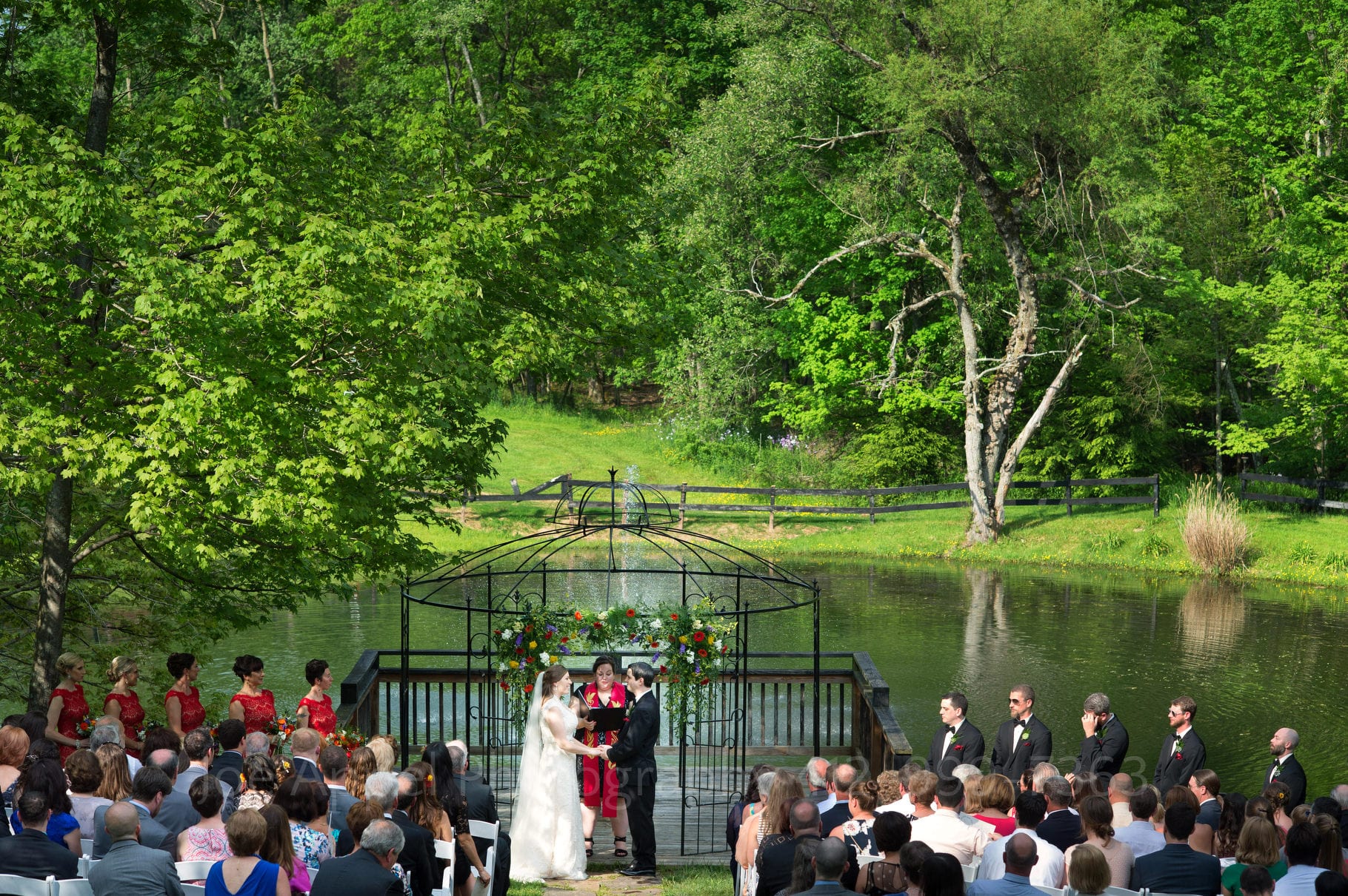 view of the ceremony site in front of the pond at Chanteclaire Farm in Garrett County Maryland during their Chanteclaire Farm Wedding.