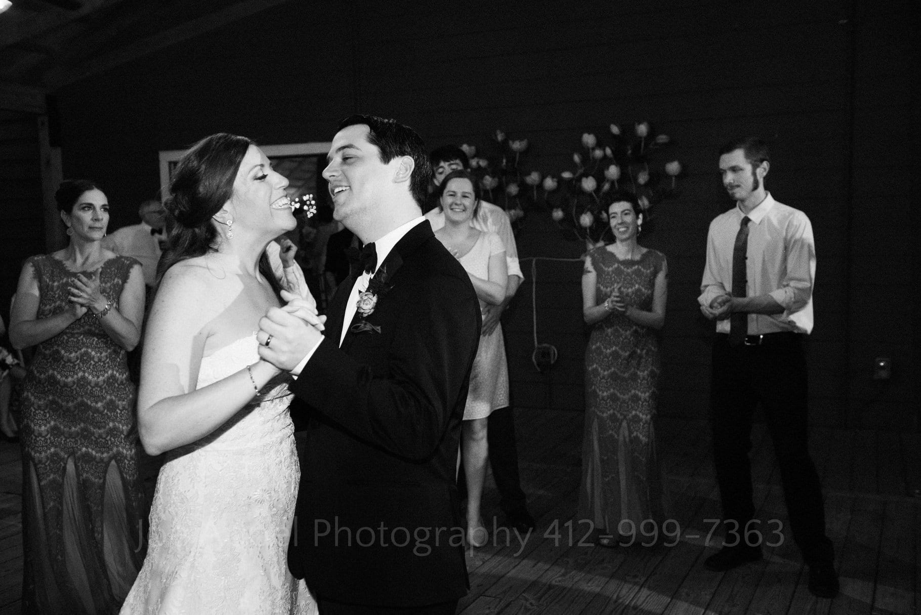 bride and groom dance in front of their guests during their Chanteclaire Farm Wedding.