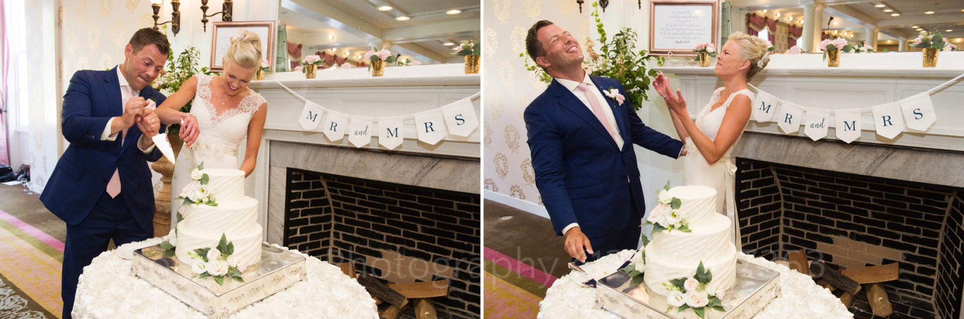 Bride and groom clown around as they cut their wedding cake in front of a fireplace with a Mr. and Mrs. banner attached to it during their Omni Bedford Springs Resort Wedding.