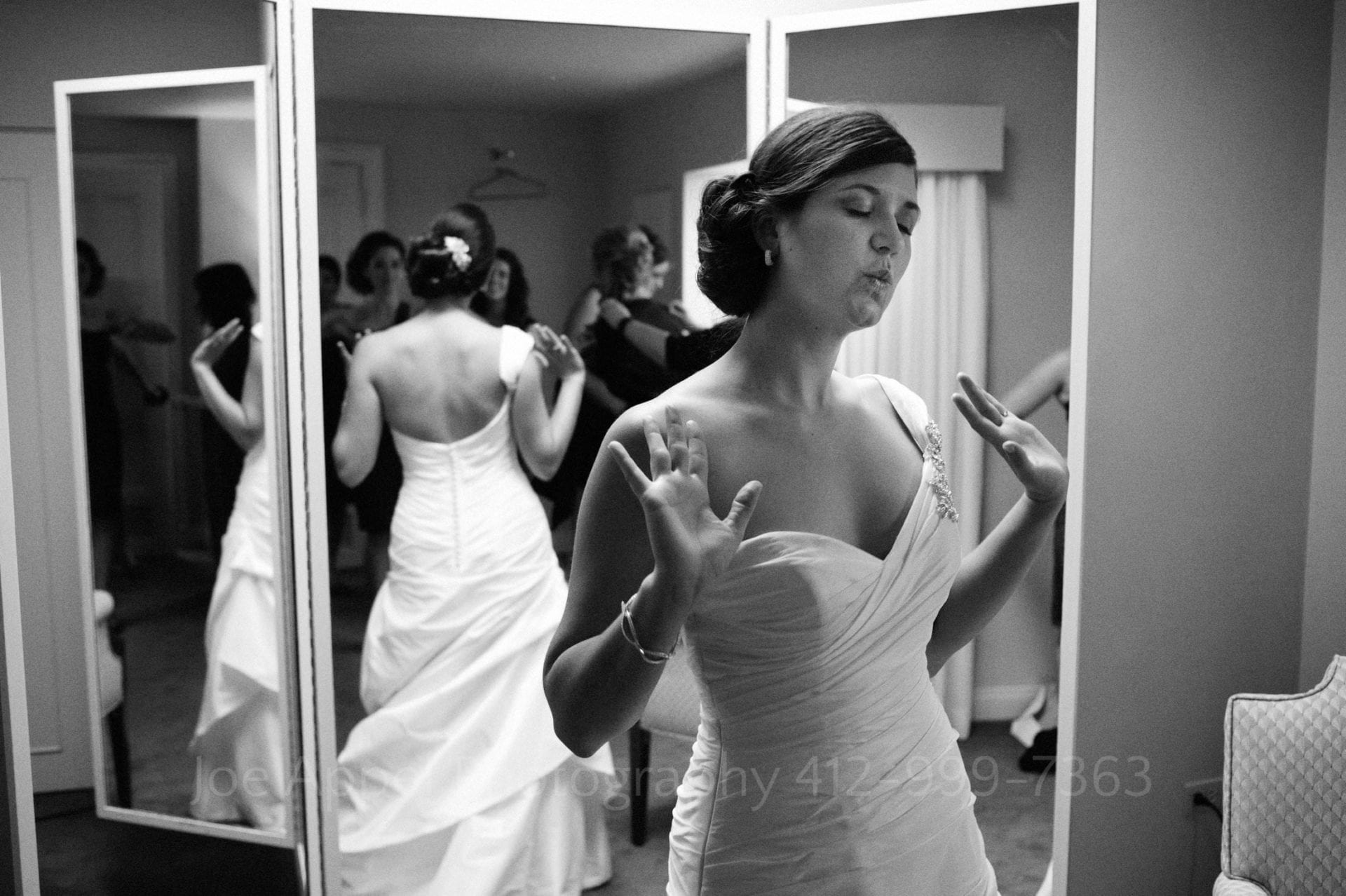 a bride dances in the waiting room at heinz memorial chapel