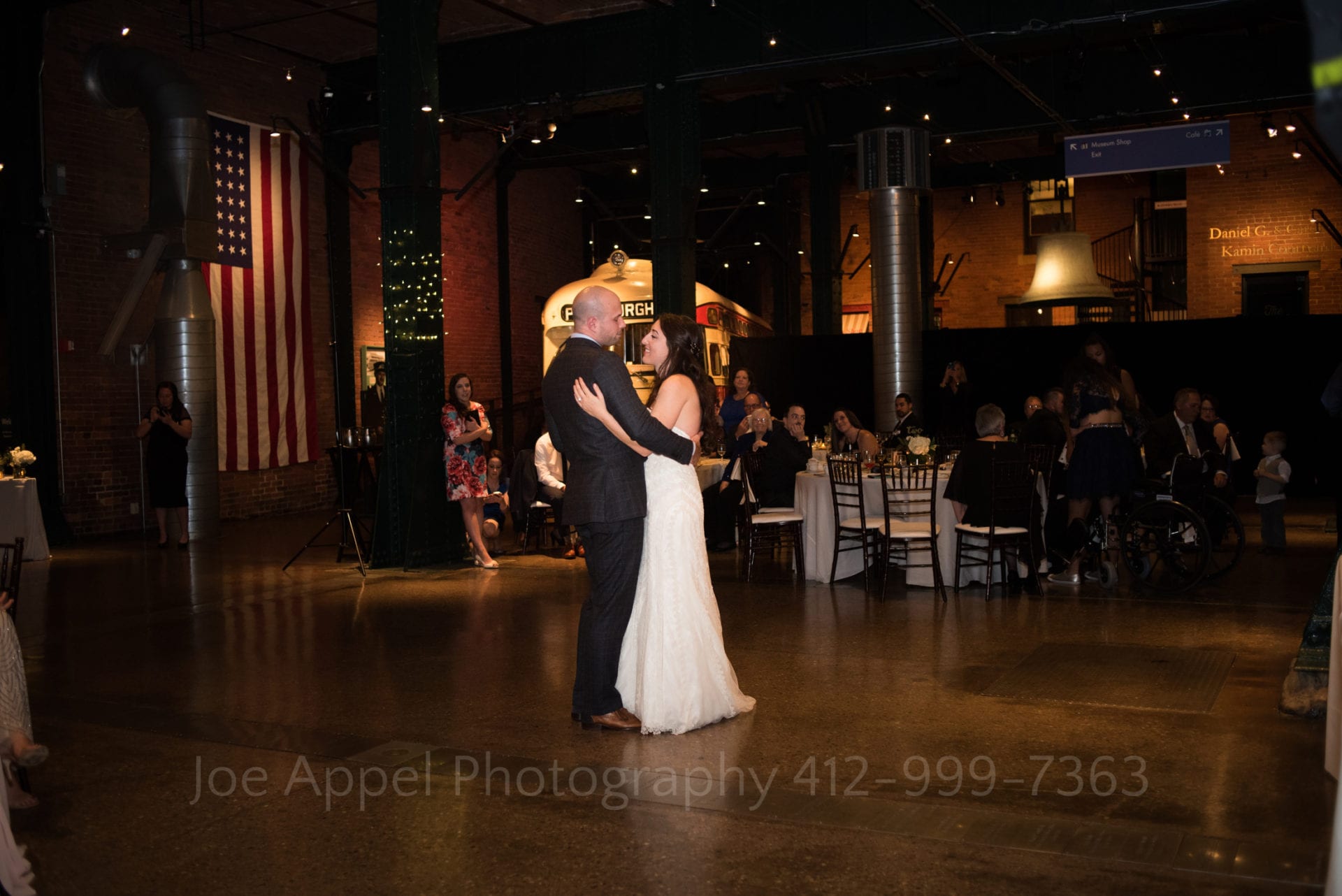 Bride and groom dance in the wide open space of the Great Hall at the Heinz History Center