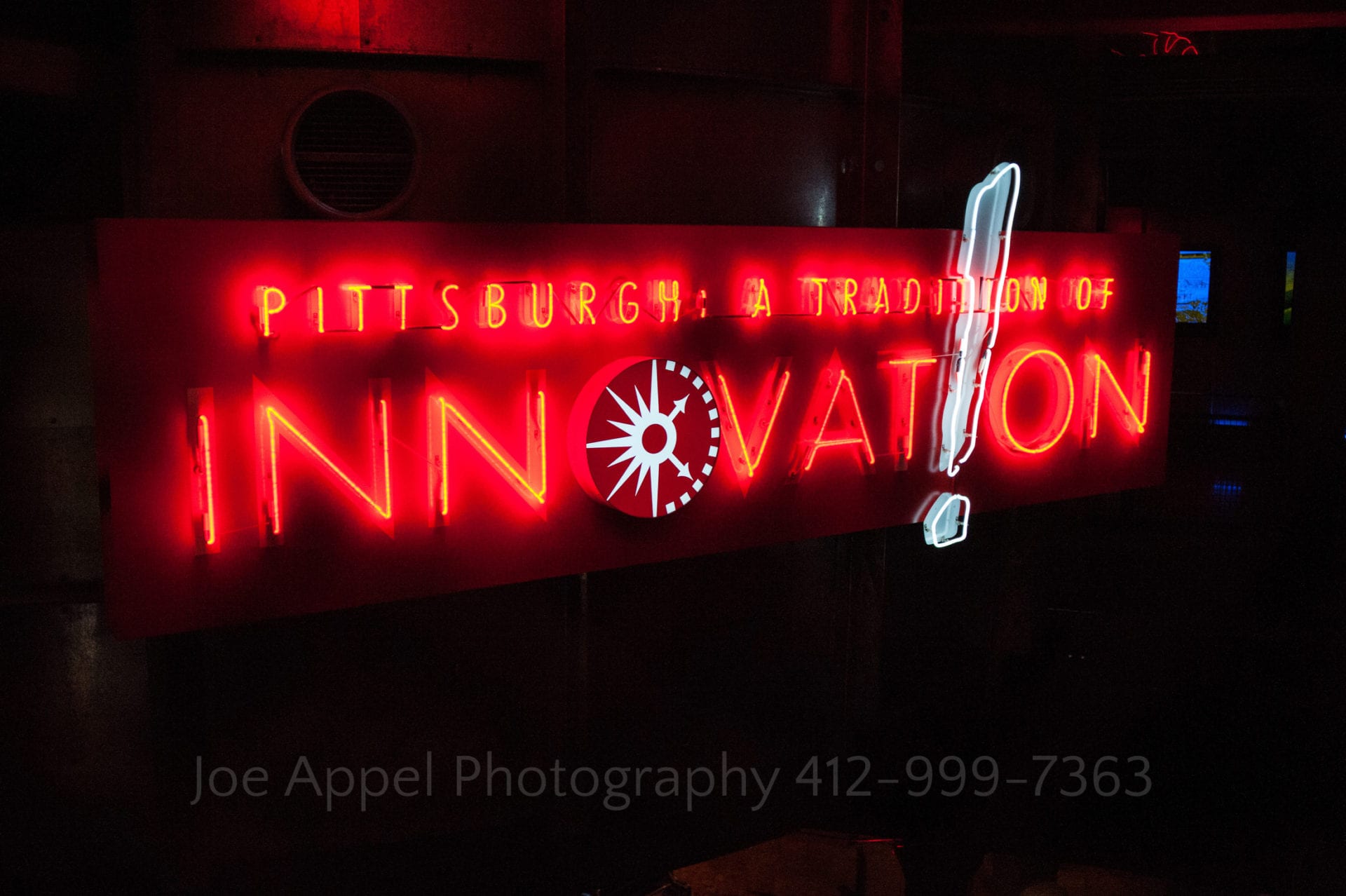red neon sign with the word Innovation