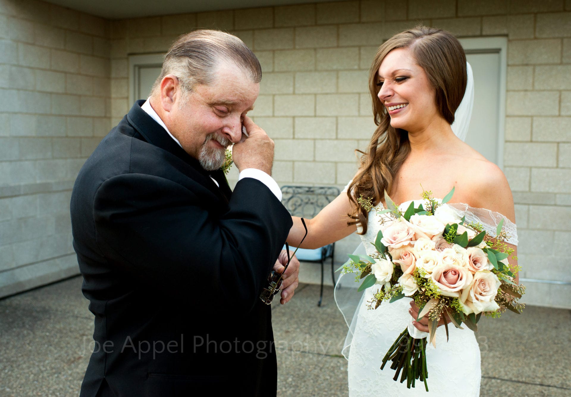 a bride comforts her crying father before walking down the aisle Phipps Conservatory Weddings