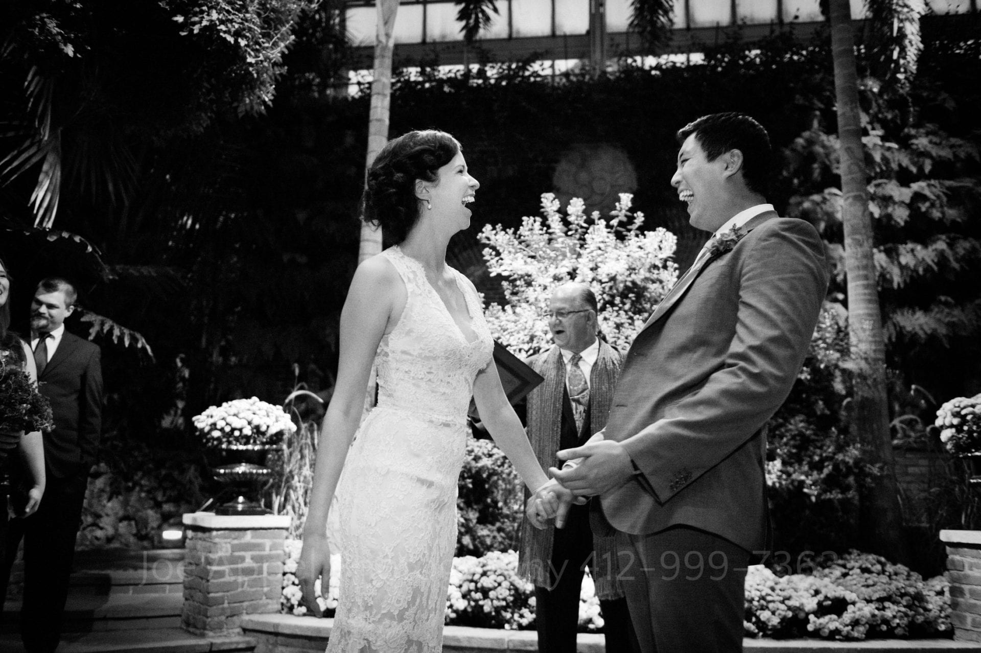 a bride and groom laugh and smile at each other Phipps Conservatory Weddings