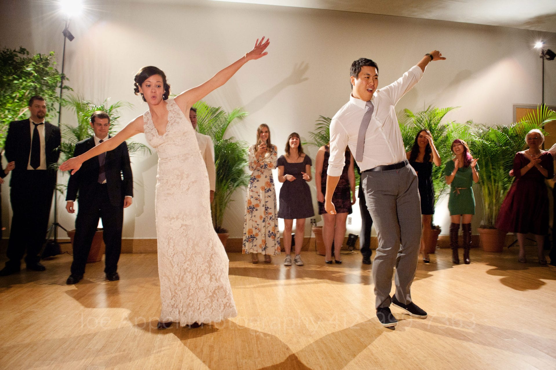 guests watch a bride and groom dance together Phipps Conservatory Weddings