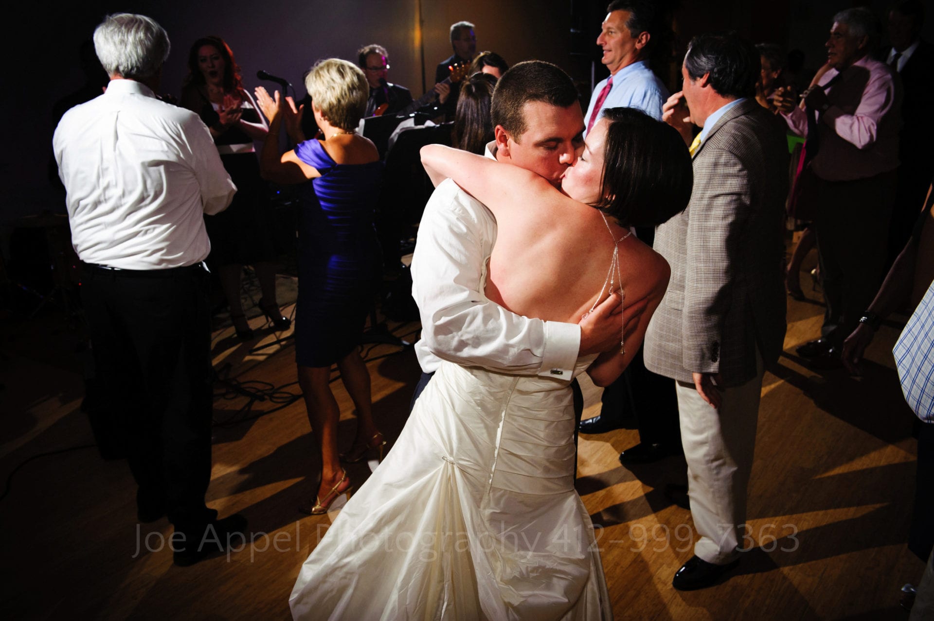 a bride and groom kiss as they dance Phipps Conservatory Weddings