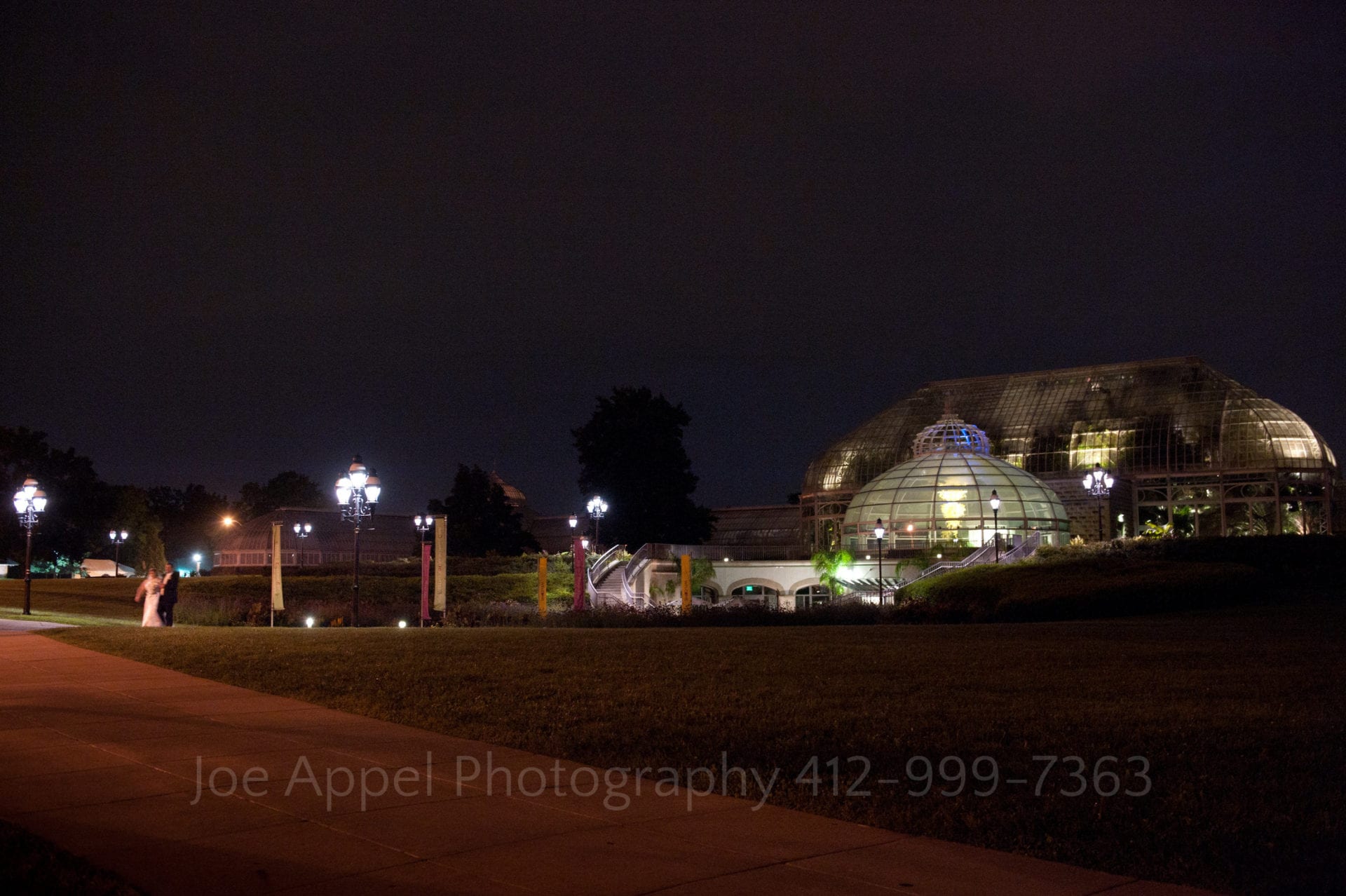 the exterior of phipps conservatory at night Phipps Conservatory Weddings