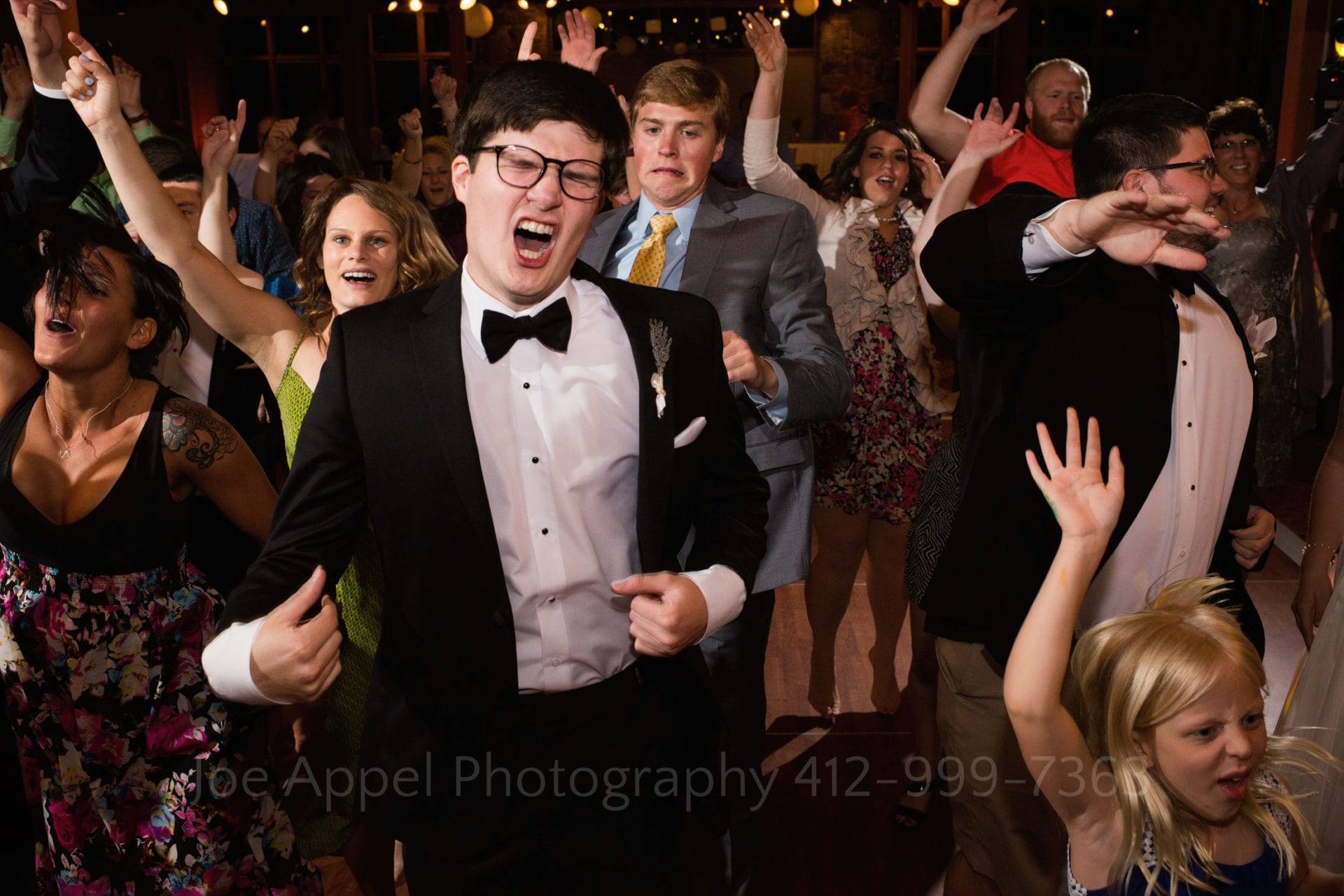 guests jump and dance Seven Springs Weddings