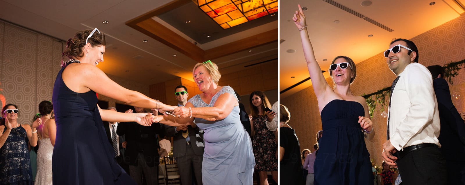 Two smiling woman dancing hand in hand and a couple wearing sunglasses during Wedding Photography at Fairmont Hotel Pittsburgh.