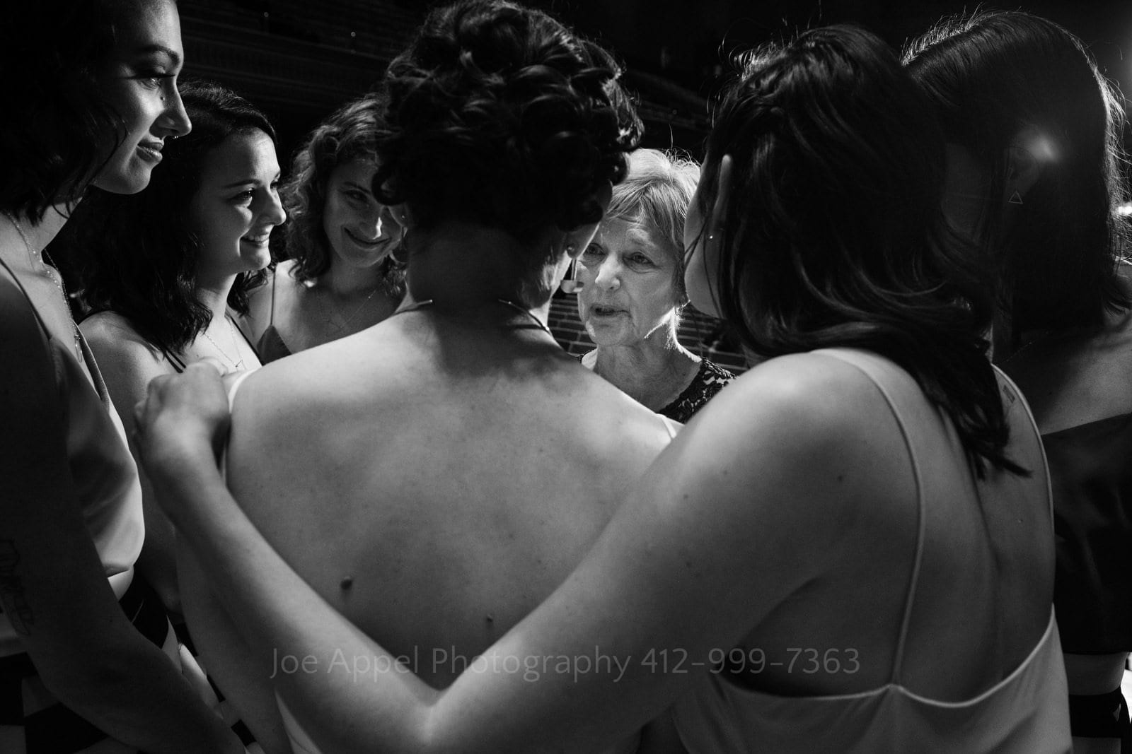 A group of young women gather around their mother for words of wisdom during Soldiers and Sailors Wedding Photos.