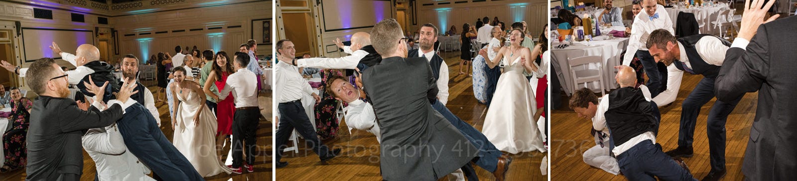 A man tries to catch and lift another man on the dance floor of Soldiers and Sailors Wedding Photos. They both fell on to the dance floor.
