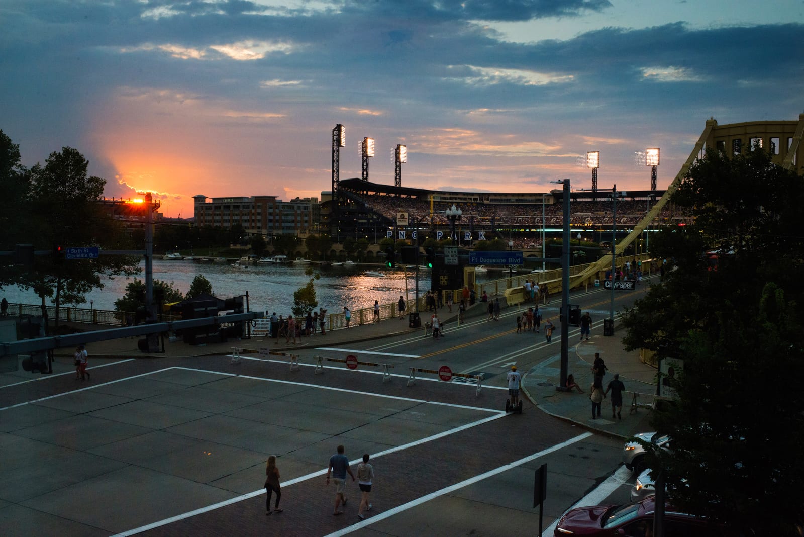 The sun sets behind PNC Park on the North Shore of the Allegheny River in Pittsburgh.