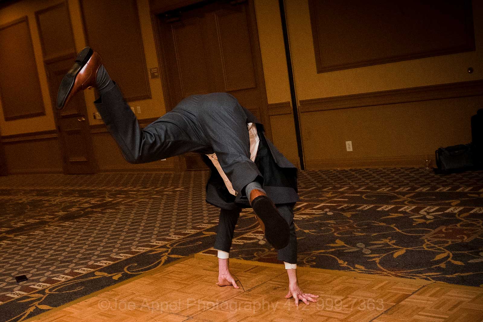 A groom tries a somersault during his wedding.
