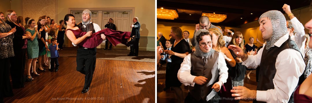 Groomsmen dance while wearing chain mail helmets during a Montour Heights Country Club wedding.
