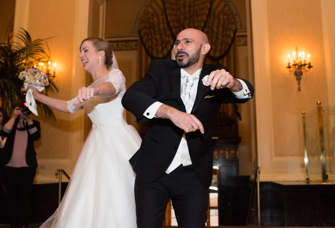 A bride and groom dance as they enter their Coptic wedding at the William Penn hotel in Pittsburgh.