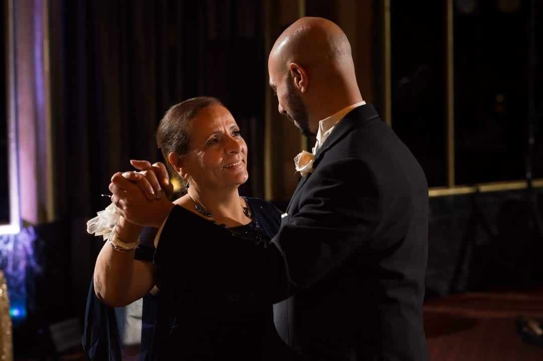 A groom and his mother dance during his Coptic wedding at the William Penn.